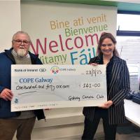 Neil Cronin presenting proceeds of club raffle to Cope